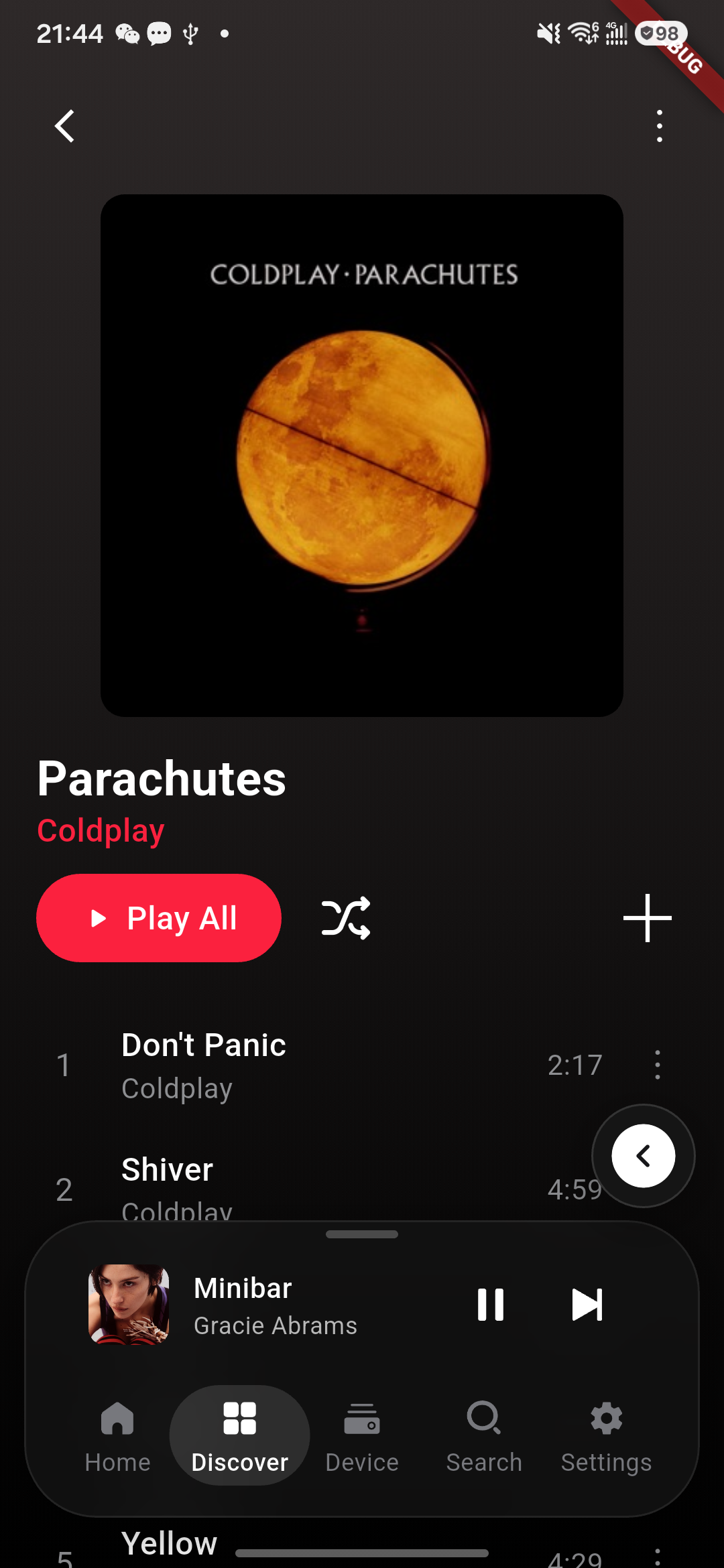 Apple Music album-detail page with track list.