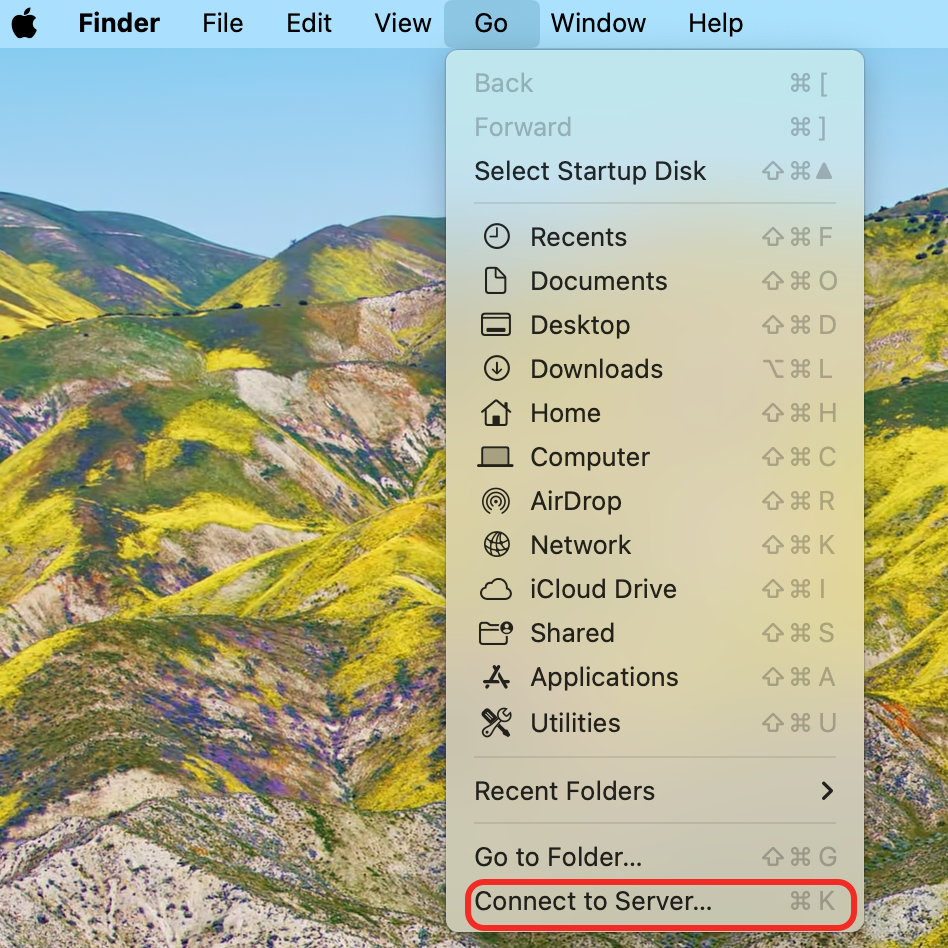 macOS Finder Go menu with Connect to Server selected.
